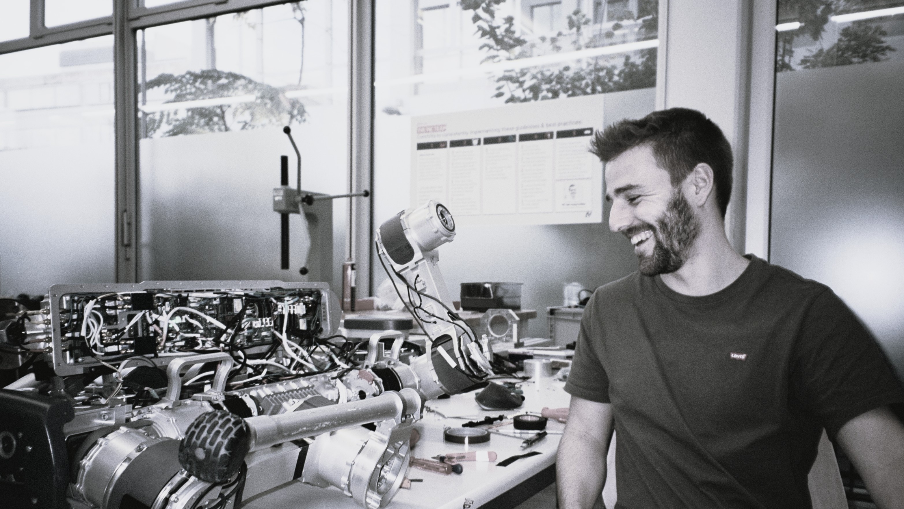 Working beside the Anymal X robot in a robotics workshop